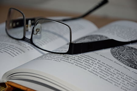 black framed eyeglasses on book thumbnail