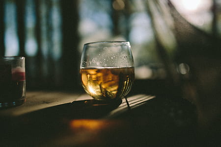 clear glass filled with liquor thumbnail