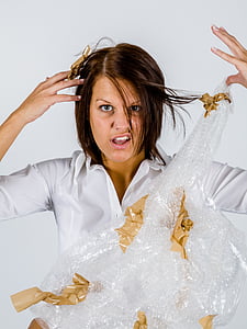 woman in white top holding bubble wrap thumbnail