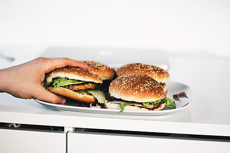 person holding burger thumbnail