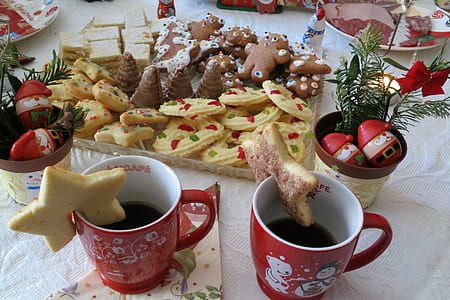 two red ceramic mugs near biscuits thumbnail