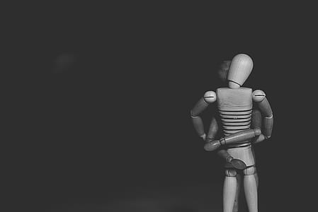 grayscale photo wooden mannequin thumbnail