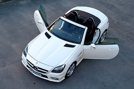 white Mercedes-Benz convertible coupe on gray concrete pavement at daytime thumbnail