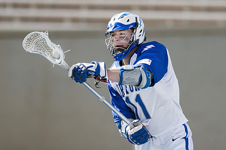 man playing lacrosse game thumbnail