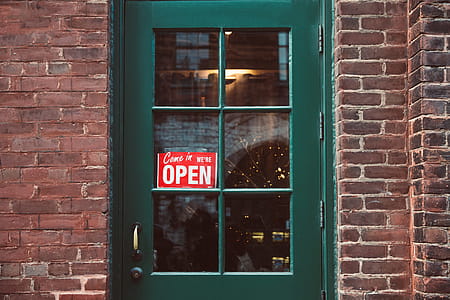 Green Door With Open Sign Photo thumbnail