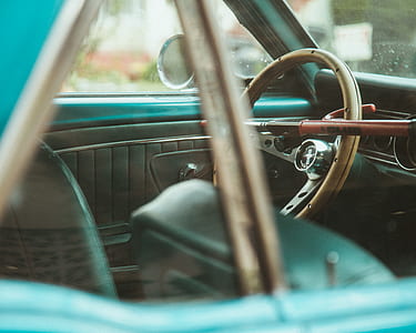 selective focus photography of brown steering wheel thumbnail