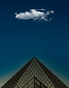 glass pyramid under blue sky thumbnail