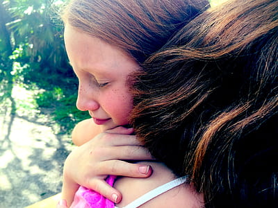 photo of two women hugging each other thumbnail