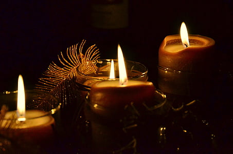 close-up photography of four lighted candles thumbnail