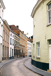 concrete road between buildings thumbnail