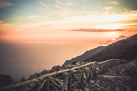 brown wooden railings during golden hour thumbnail
