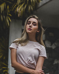 woman holding her arm thumbnail