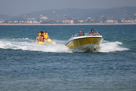 group of people riding speed boat at daytime thumbnail