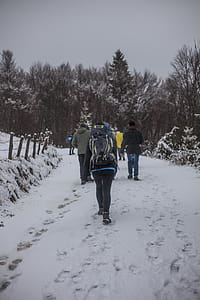 People Walking on Snowy Road during Winter thumbnail