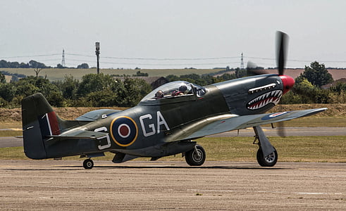 black, red, and blue stunt plane on ground thumbnail