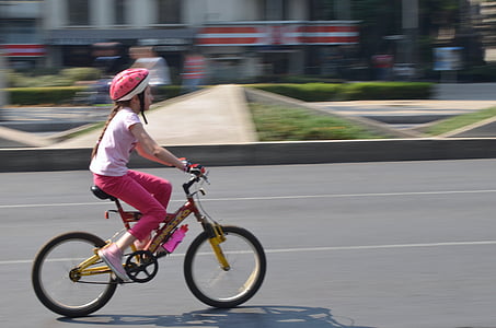 time lapse photo of girl in bicycle thumbnail