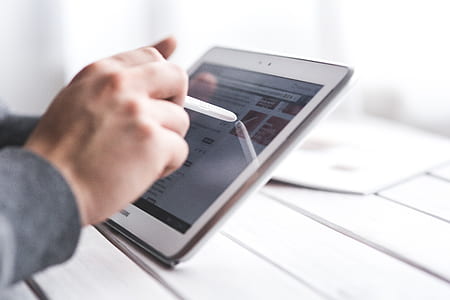 person using white tablet computer thumbnail