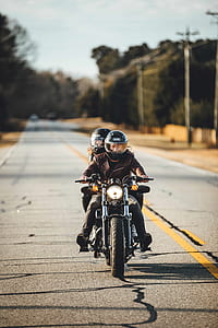 two person riding motorcycle on road thumbnail