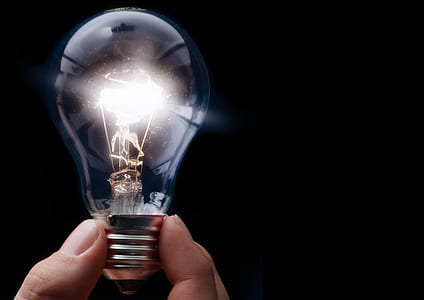 person holding lighted bulb thumbnail