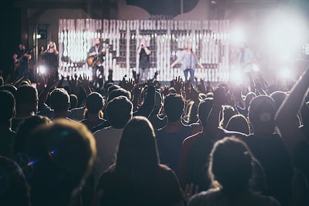 music band performing on stage with crowd thumbnail
