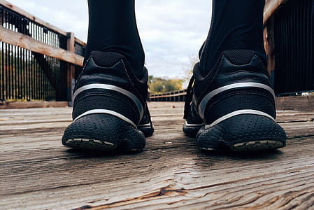 closeup photo of person wearing running shoes thumbnail