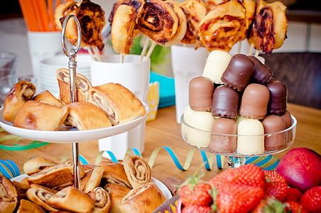 variety of pastries and strawberries on table thumbnail