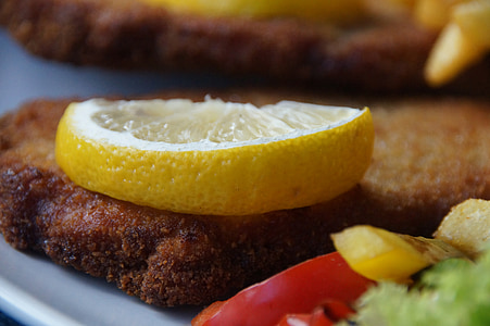 sliced lemon on fried meat thumbnail