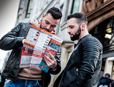 men reading brochure thumbnail