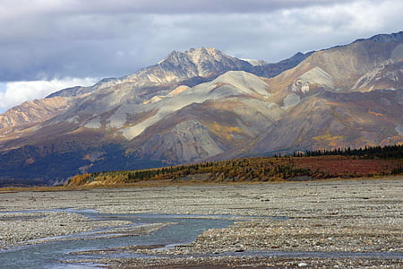 empty brown field near mountain thumbnail