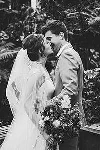 married couple kissing grayscale photo thumbnail