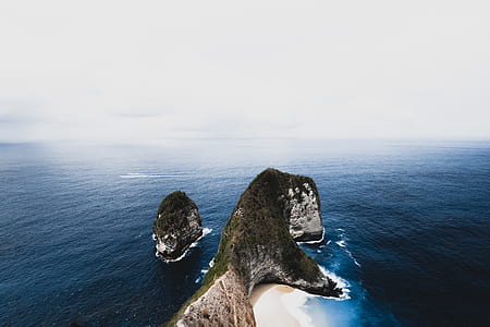 rock monolith in the middle of the sea thumbnail