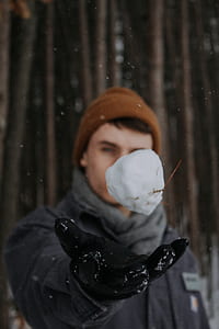man throwing snow ball thumbnail