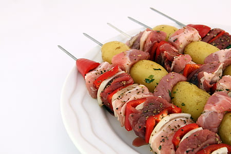 four assorted kebabs on plate thumbnail