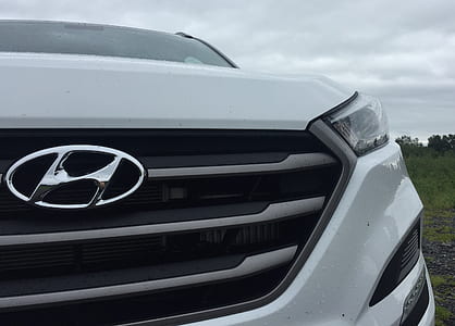close-up photography of white Hyundai vehicle thumbnail
