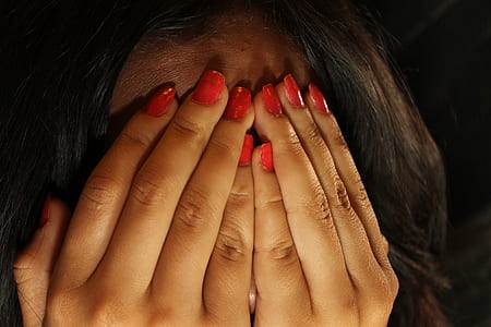 fingernails with red nail polish thumbnail