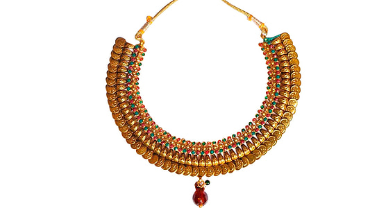 assorted-color jeweled gold-colored necklace on white surface thumbnail