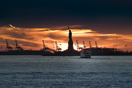 silhouette of Statue of Liberty during sunset thumbnail