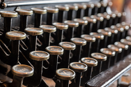 selective focus photography of manual typewriter thumbnail