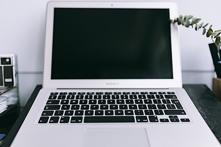 Elegant workspace with Macbook, iPhone, business cards and notebooks thumbnail