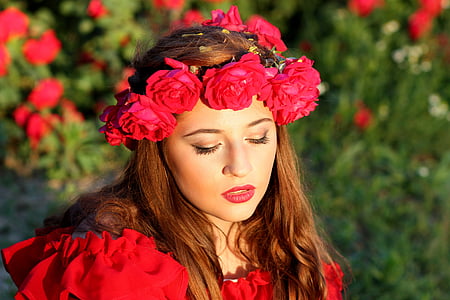 woman wearing red top and flower headdress thumbnail