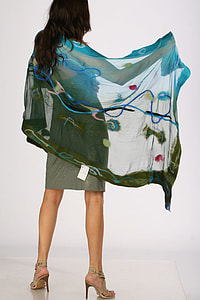 woman wearing gray midi dress with green and teal scarf posing for photo thumbnail