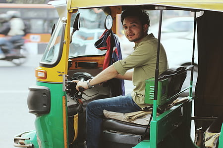 man riding on auto rickshaw thumbnail