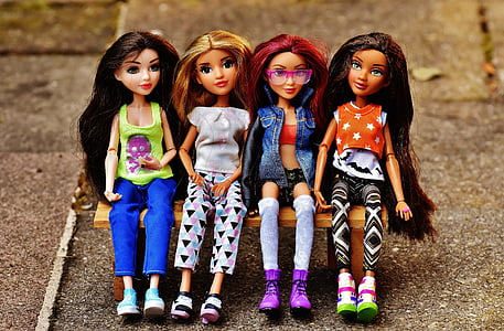 four dolls miniatures sitting on bench toy thumbnail