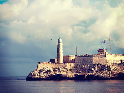 brown lighthouse during daytime thumbnail