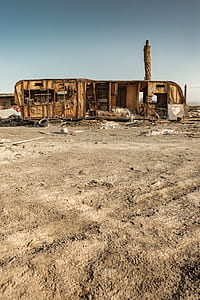 abandoned RV under blue sky at daytime thumbnail
