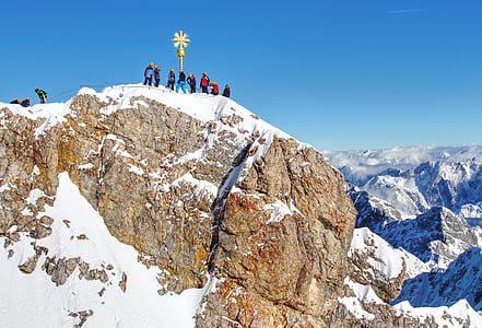 group of people on top of mountain thumbnail