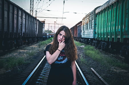 woman wearing black top on subway thumbnail