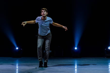man standing on stage thumbnail