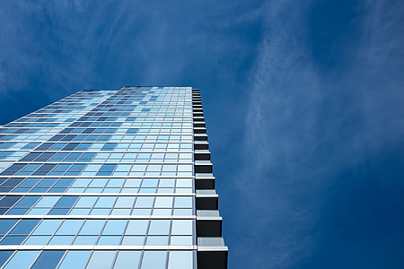 low angle photography of glass building during daytime thumbnail