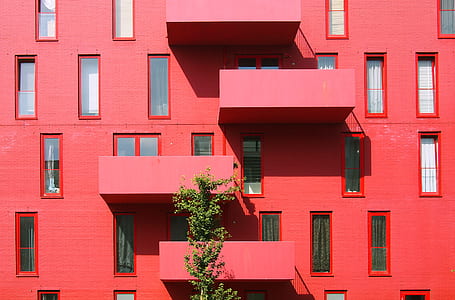 landscape photography of red concrete building thumbnail